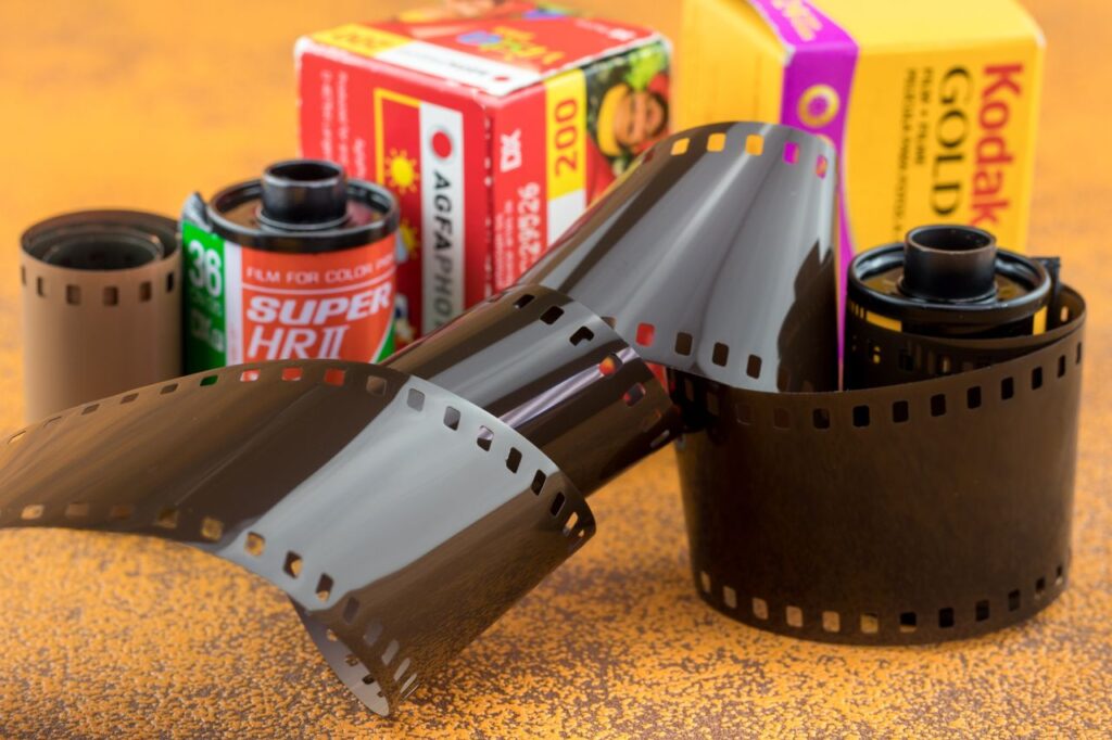 Detailed shot of vintage film rolls and canisters, evoking nostalgia and classic photography.